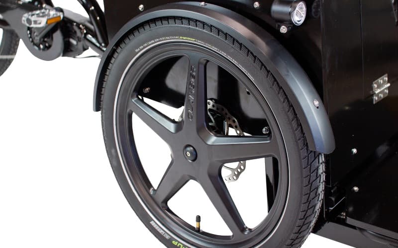 A custom alloy front wheel on a Ricky Rickshaw