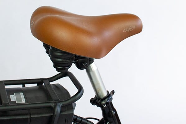 The brown leather saddle and quick-release seat post on a Tribe Original