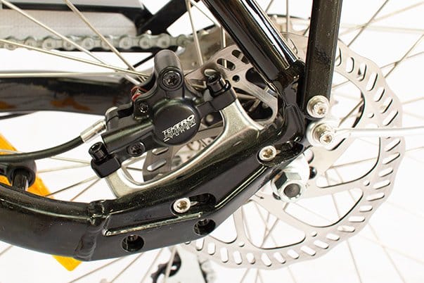 A Tektro hydraulic disc brake on a Tribe Original wheel