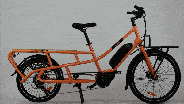 A Tribe Evamos Longtail cycling through its carrying configurations