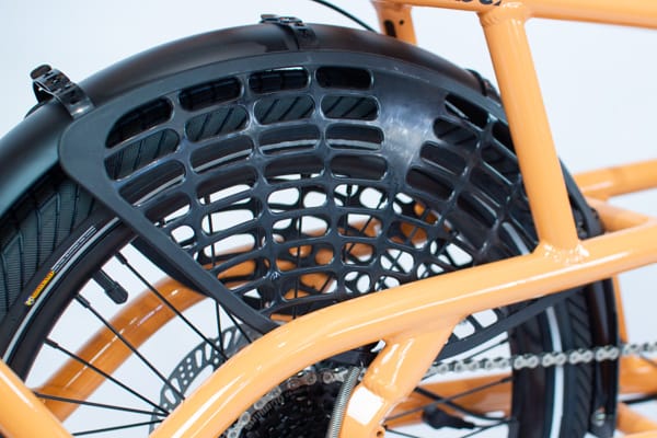 The integrated wheel skirt covering the rear spokes of a Tribe Evamos Longtail