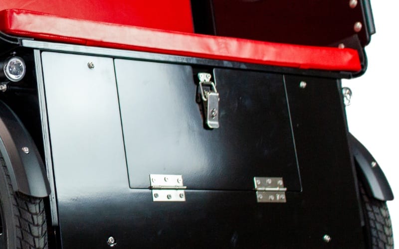 The storage area under the seat of a Ricky Rickshaw