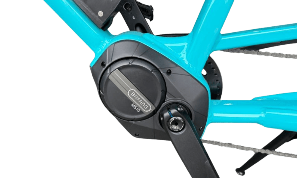 A Bafang M510 mid drive motor mounted at the pedals of a cargo bike, driving the chainring